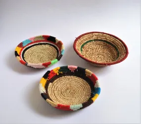 Tribal woven wall plates with wool decoration